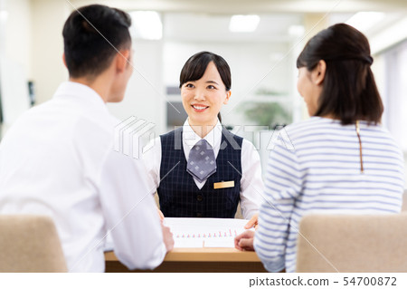Young couple (consulting) Young couple (consulting) 54700872