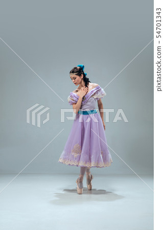 Contemporary ballroom dancer on grey studio background Contemporary ballroom dancer on grey studio background 54701343