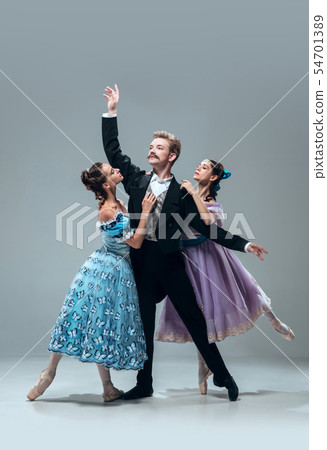 Contemporary ballroom dancers on grey studio background Contemporary ballroom dancers on grey studio background 54701389