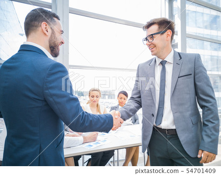 Handshake of business partners 54701409