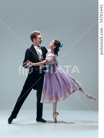 Contemporary ballroom dancers on grey studio background Contemporary ballroom dancers on grey studio background 54701443