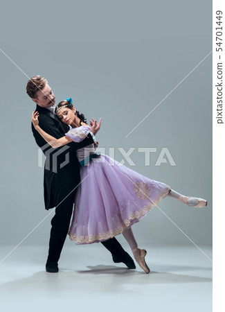 Contemporary ballroom dancers on grey studio background Contemporary ballroom dancers on grey studio background 54701449