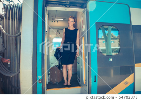 Young attractive woman bussinessman says goodbye Young attractive woman bussinessman says goodbye 54702373
