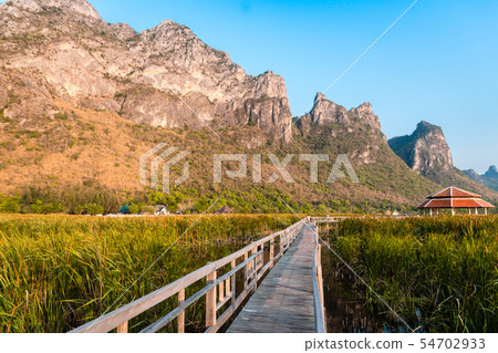 Wooden Bridge in the lake and mountain lanscape on 54702933