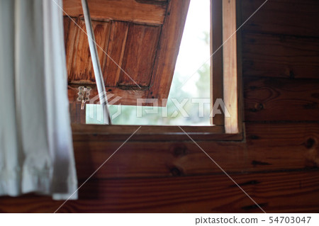 Looking out wooden window on beach house, opened just a little bit, blurred bright landscape outside Looking out wooden window on beach house, opened just a little bit, blurred bright landscape outside 54703047