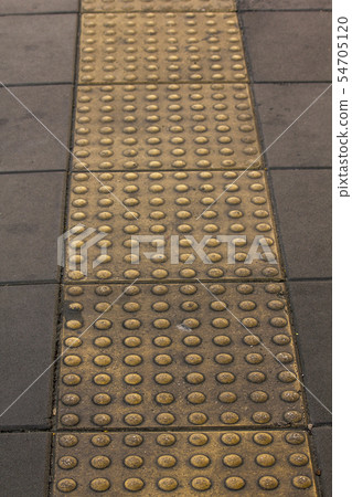 Braille block on the sidewalk for the visually imp Braille block on the sidewalk for the visually imp 54705120