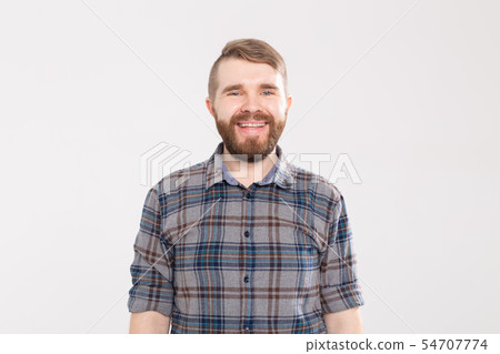 Handsome happy bearded man smiling and laughing on white background Handsome happy bearded man smiling and laughing on white background 54707774