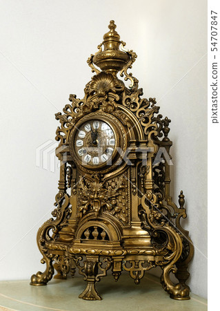 Antique mechanical clock made of metal Antique mechanical clock made of metal 54707847
