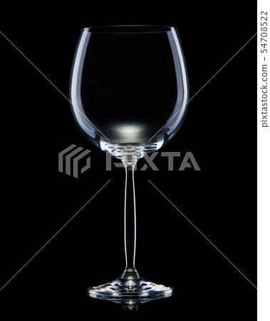Empty glass for red wine isolated on black background. 54708522