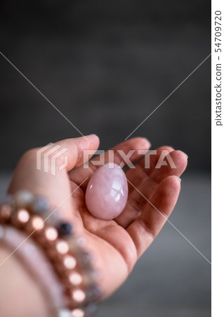 Woman holds yoni egg in hand Woman holds yoni egg in hand 54709720