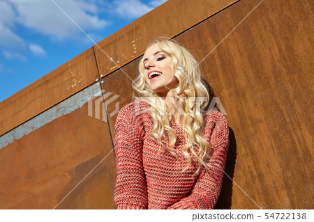 Autumn portrait of girls on a rusty steel wall Autumn portrait of girls on a rusty steel wall 54722138