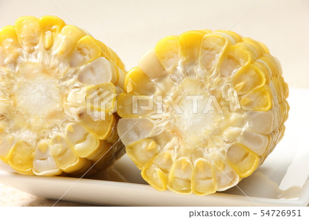 Cross section of boiled and cut corn (sweet corn). Ingredients for summer season. Cross section of boiled and cut corn (sweet corn). Ingredients for summer season. 54726951