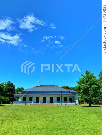 Building built in the meadow 54729882