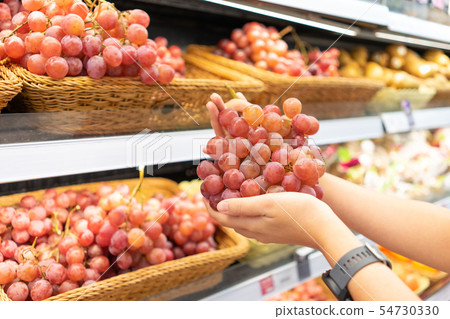 Hands that are picking fruits and vegetables from Hands that are picking fruits and vegetables from 54730330
