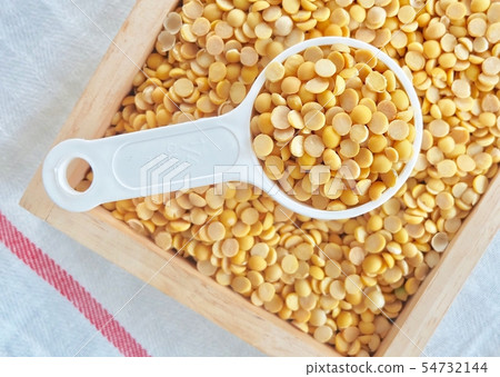 Yellow Dried Soybeans in A Measuring Spoon 54732144