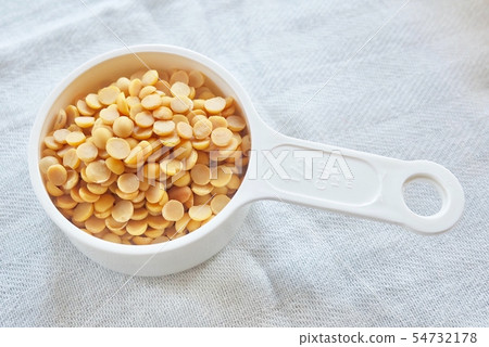 Yellow Dried Soybeans in A Measuring Spoon Yellow Dried Soybeans in A Measuring Spoon 54732178