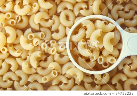 Dried Elbow Macaroni in A Measuring Cup Dried Elbow Macaroni in A Measuring Cup 54732222