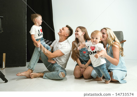 Young family spending time together and smiling 54733574