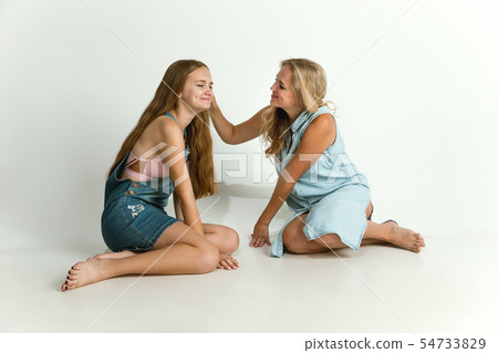 Mom spending time with her daughter and smiling Mom spending time with her daughter and smiling 54733829