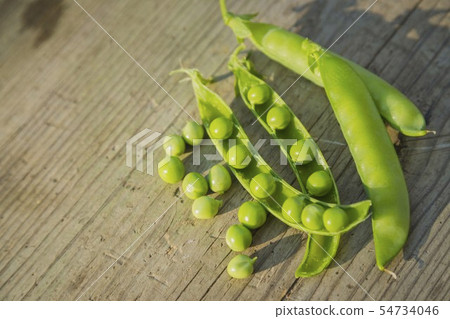 pea pods on wooden table pea pods on wooden table 54734046
