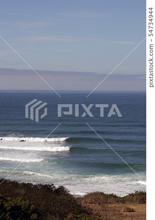 Perfect waves for surfing breaking on the shore Perfect waves for surfing breaking on the shore 54734944