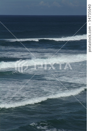 Perfect waves for surfing breaking on the shore  54735040