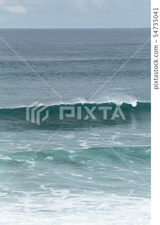 Perfect waves for surfing breaking on the shore Perfect waves for surfing breaking on the shore 54735041