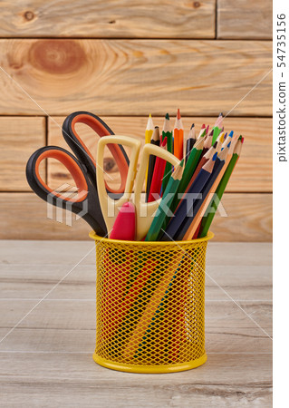 Colored pencils in basket. 54735156