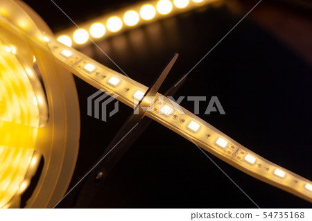 cutting off excess pieces of LED strip 54735168