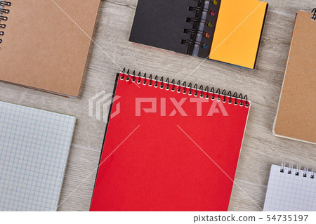 Colorful notebooks on wooden background. Colorful notebooks on wooden background. 54735197