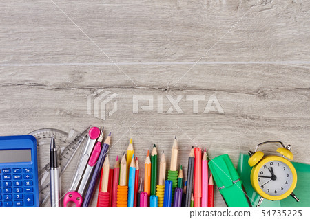 School accessories on gray wooden background. 54735225