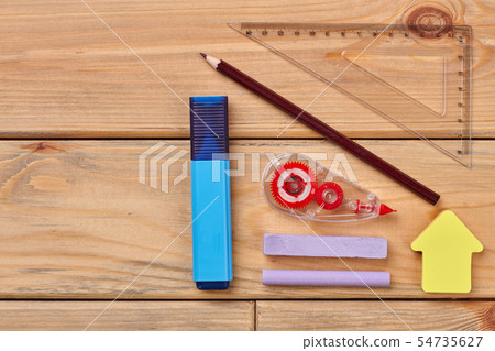School supplies on wooden background. School supplies on wooden background. 54735627