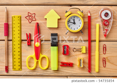Colorful school accessories on wooden background. Colorful school accessories on wooden background. 54735854