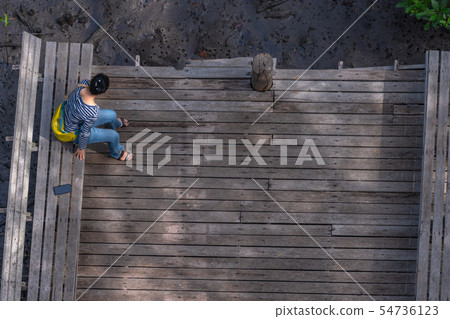 top view lady sitting on balcony 54736123