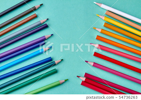 Composition with multicolored pencils on color background. 54736263