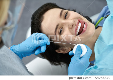 Pretty woman's teeth treatment in dental clinic Pretty woman's teeth treatment in dental clinic 54736879