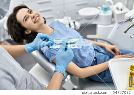Pretty woman's teeth treatment in dental clinic Pretty woman's teeth treatment in dental clinic 54737082