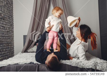 Father and mother with little daughter Father and mother with little daughter 54739149
