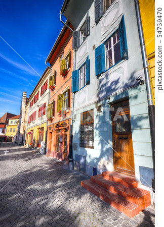 Beautiful medieval houses with different colors 54739470