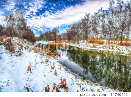 Scenic view of the river and trees in winter 54740421