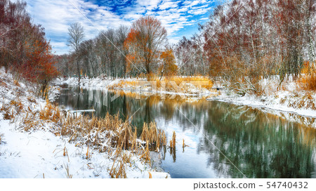 Scenic view of the river and trees in winter Scenic view of the river and trees in winter 54740432