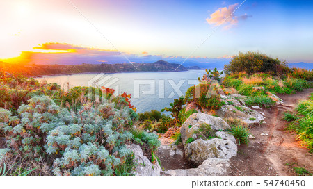 Dramatic spring sunset on the the cape Milazzo 54740450