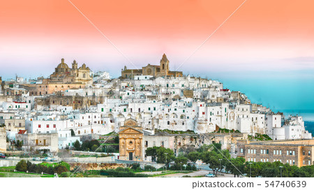 Ostuni white town skyline at sunrise 54740639
