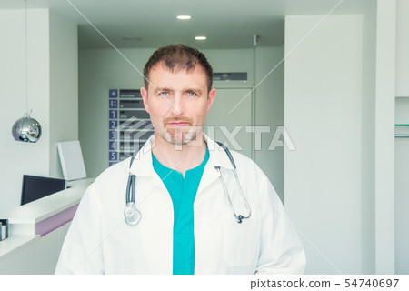 Mature male confident Doctor's portrait standing 54740697