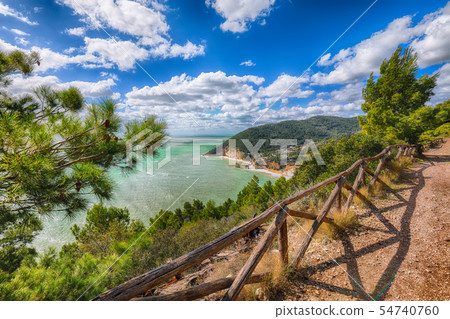 Picturesque islets Faraglioni di Puglia in summer Picturesque islets Faraglioni di Puglia in summer 54740760