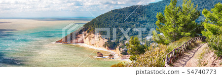 Picturesque islets Faraglioni di Puglia in summer Picturesque islets Faraglioni di Puglia in summer 54740773