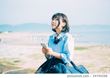 High school girl and smartphone High school girl and smartphone 54744398