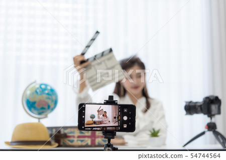 Young Asian woman as vlogger or blogger attending Young Asian woman as vlogger or blogger attending 54744564