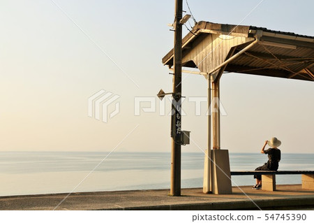Ehime Prefecture Shimosu Station and one woman at dusk Ehime Prefecture Shimosu Station and one woman at dusk 54745390