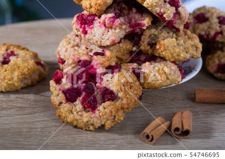 Closeup of oatmeal cookies on plate on wooden background Closeup of oatmeal cookies on plate on wooden background 54746695